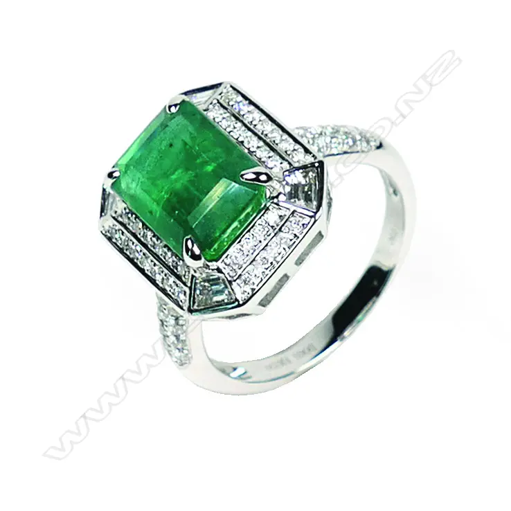 An 18ct white gold emerald and diamond ring Image 1++