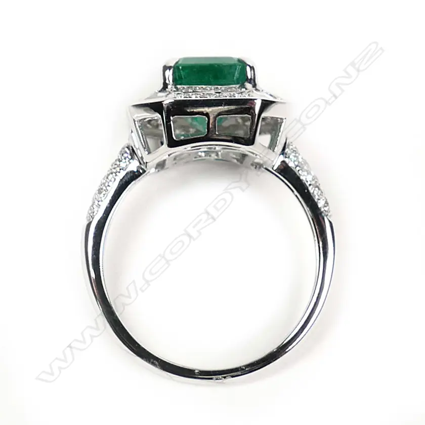 An 18ct white gold emerald and diamond ring Image 1++