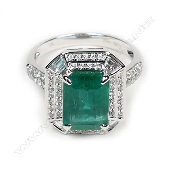 An 18ct white gold emerald and diamond ring Image 1++