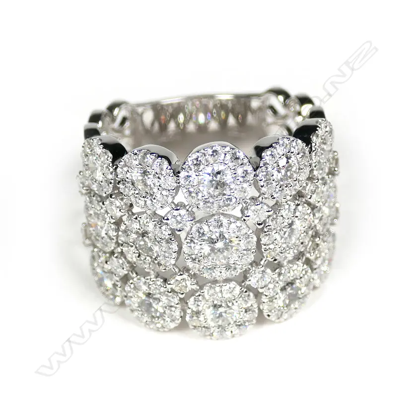 An impressive wide modern 18ct white gold and multi diamond ring Image 1++