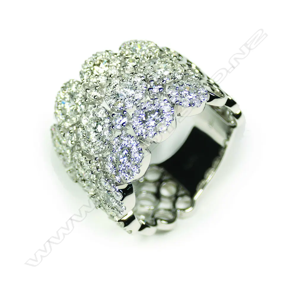 An impressive wide modern 18ct white gold and multi diamond ring Image 1++
