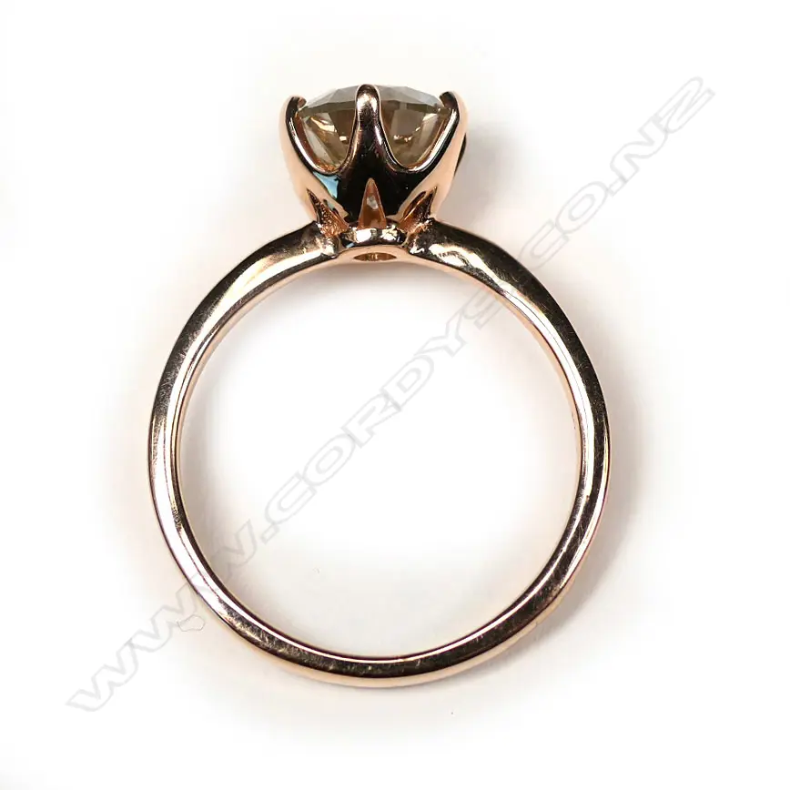 A 14ct rose gold light yellow diamond solitaire ring Image 1++