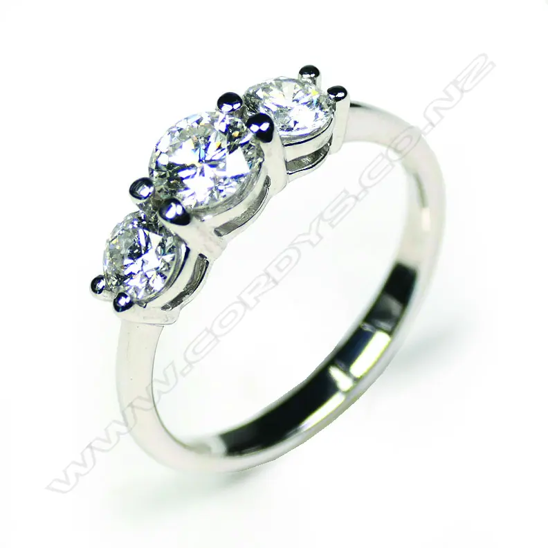 A 14ct white gold diamond trilogy ring Image 1++