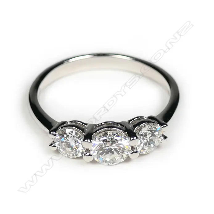 A 14ct white gold diamond trilogy ring Image 1++