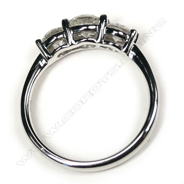 A 14ct white gold diamond trilogy ring Image 1++