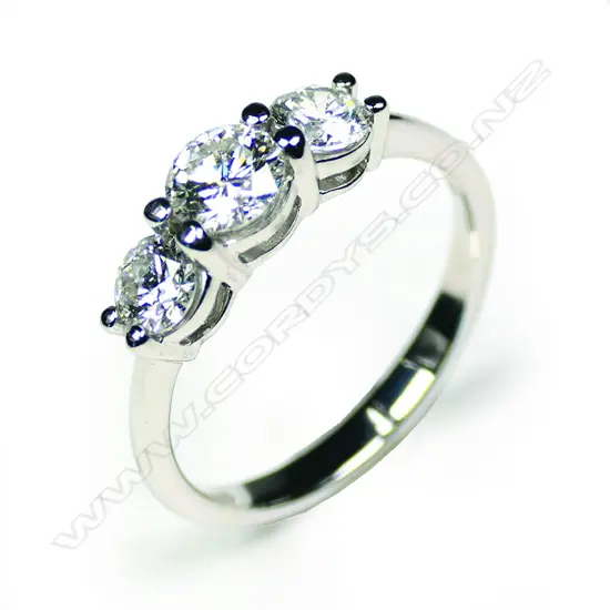 A 14ct white gold diamond trilogy ring