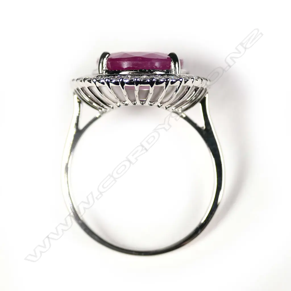 A 14ct yellow gold ruby and diamond halo ring Image 1++