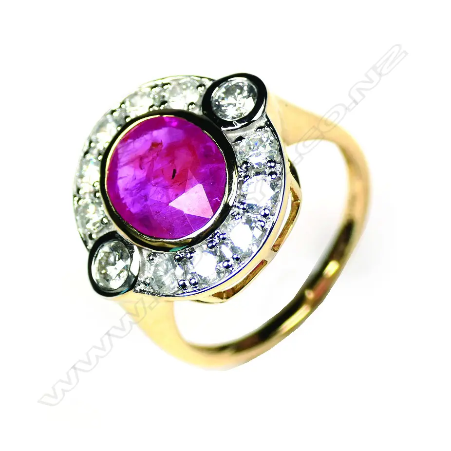 A 14ct yellow gold ruby and diamond halo ring Image 1++