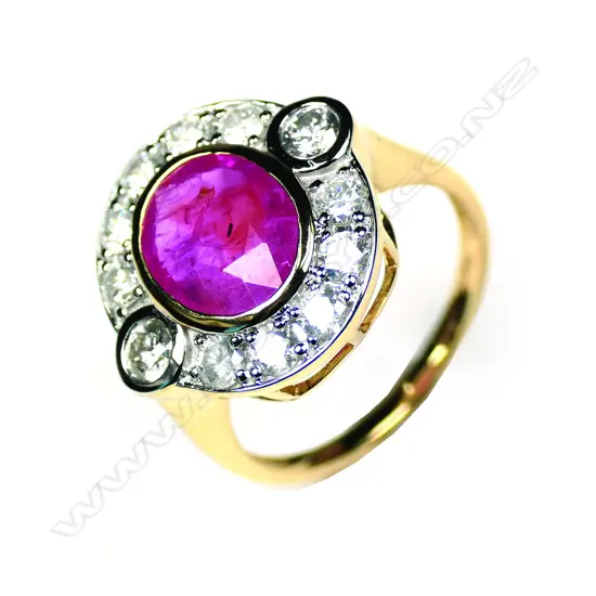 A 14ct yellow gold ruby and diamond halo ring