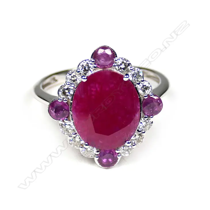 A 14ct white gold ruby and diamond halo ring Image 1++