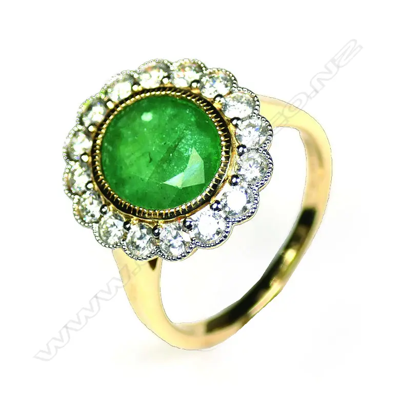 A 14ct gold Zambian emerald and diamond halo ring Image 1++