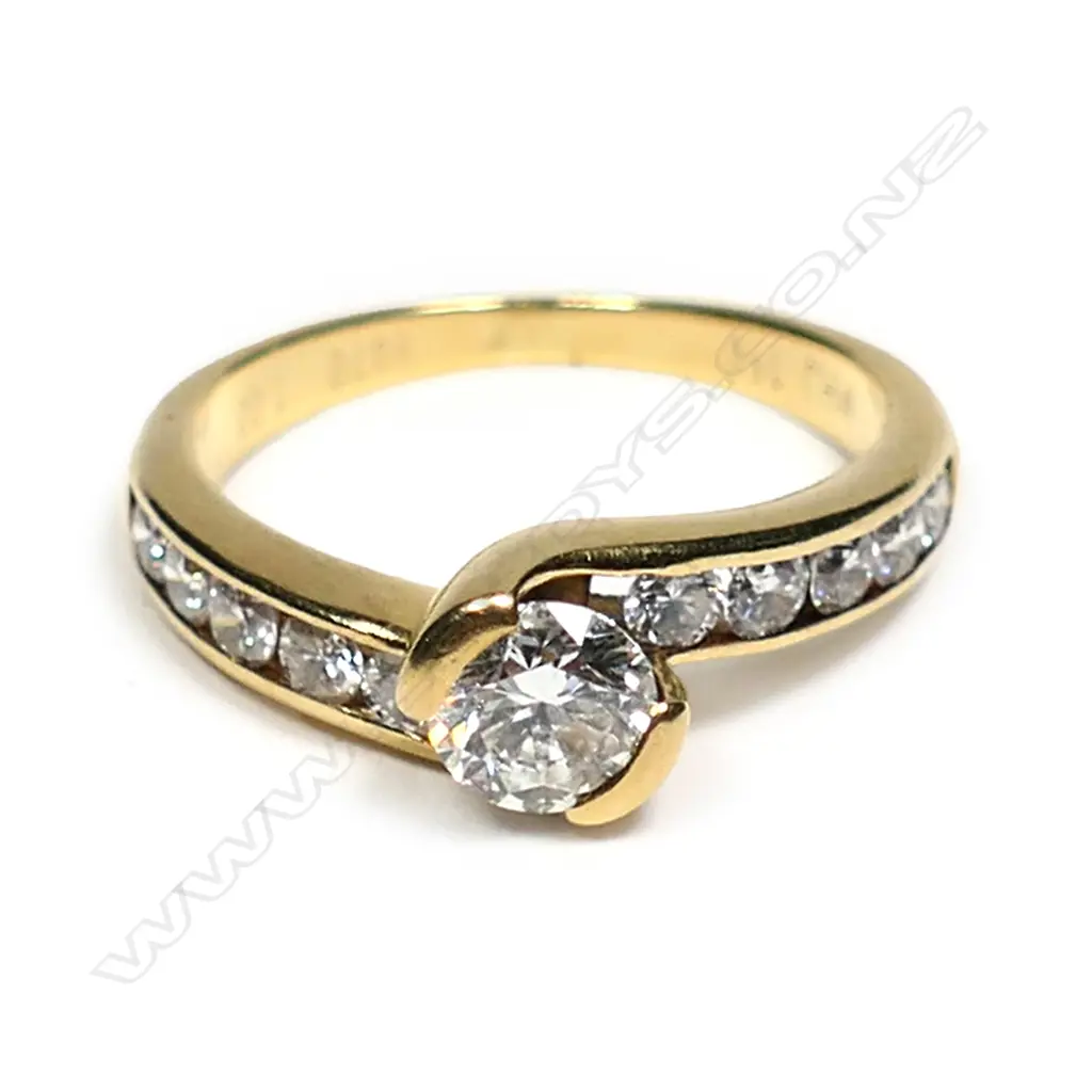 An 18ct gold and diamond solitaire ring Image 1++