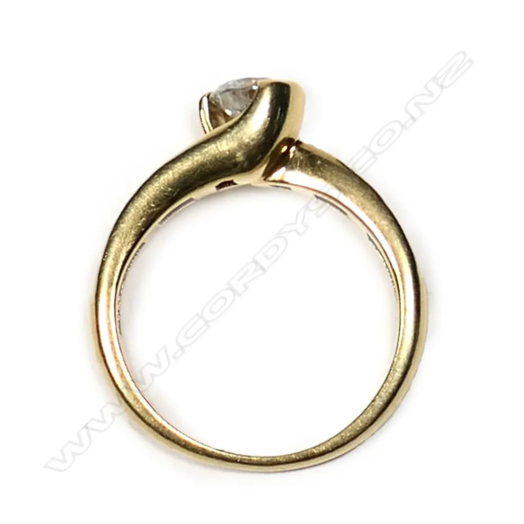 An 18ct gold and diamond solitaire ring Image 1++