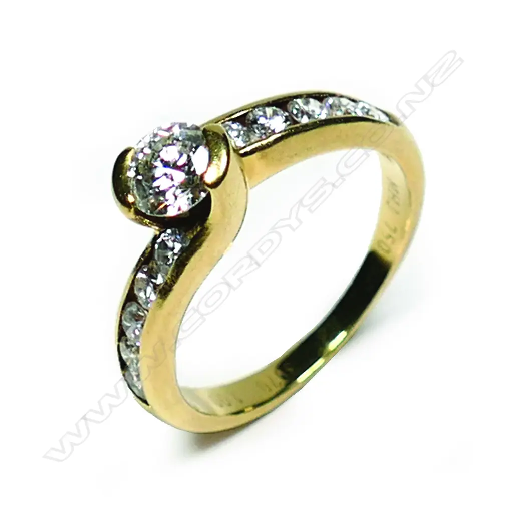 An 18ct gold and diamond solitaire ring Image 1++