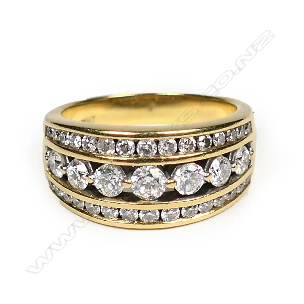 An 18ct multi diamond channel set ring Image 1++