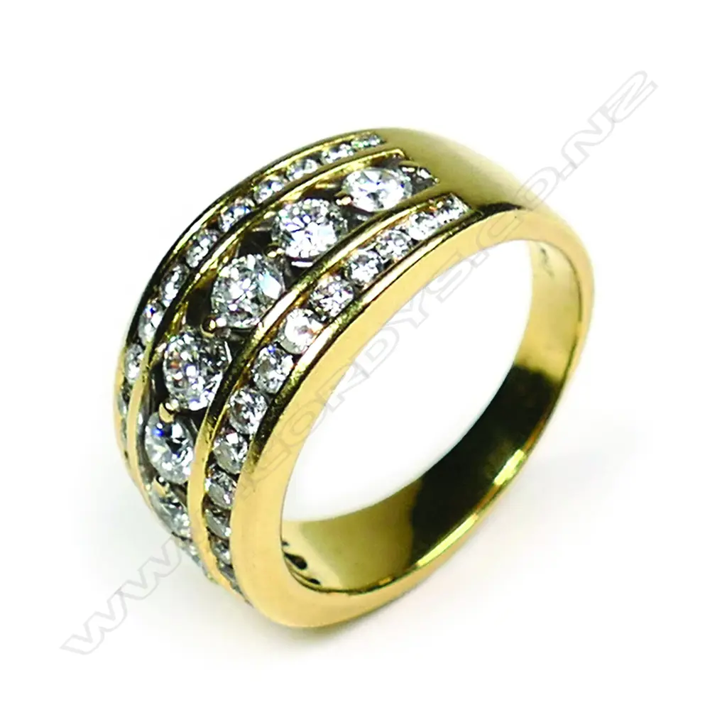 An 18ct multi diamond channel set ring Image 1++