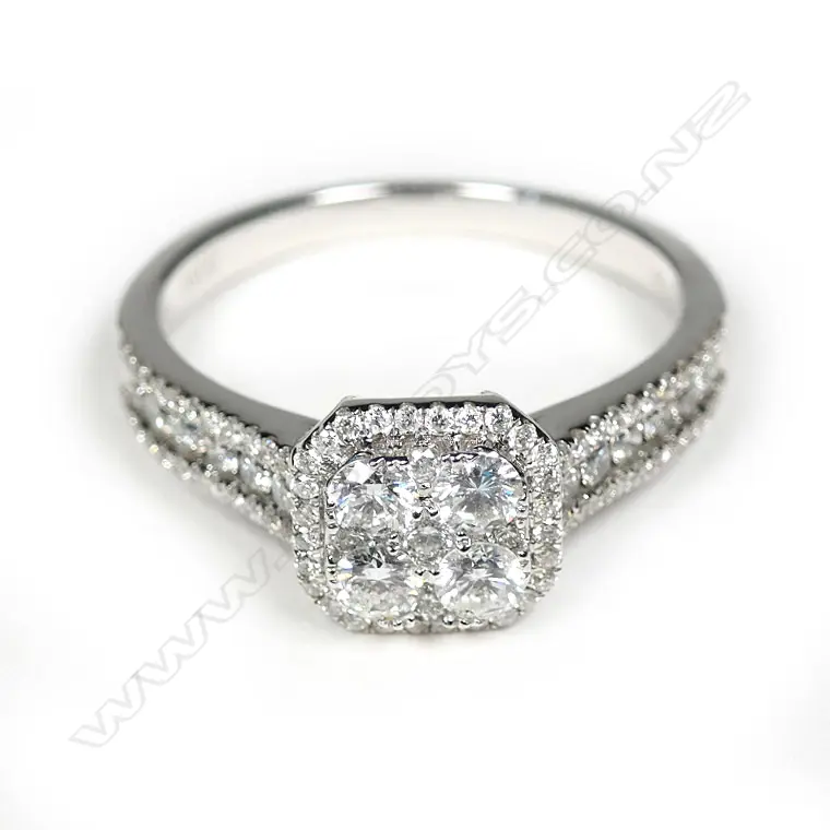 An 18ct white gold diamond cluster ring Image 1++