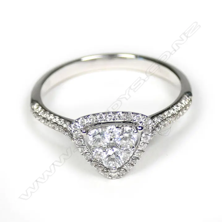 An 18ct white gold diamond cluster ring of triangular form Image 1++