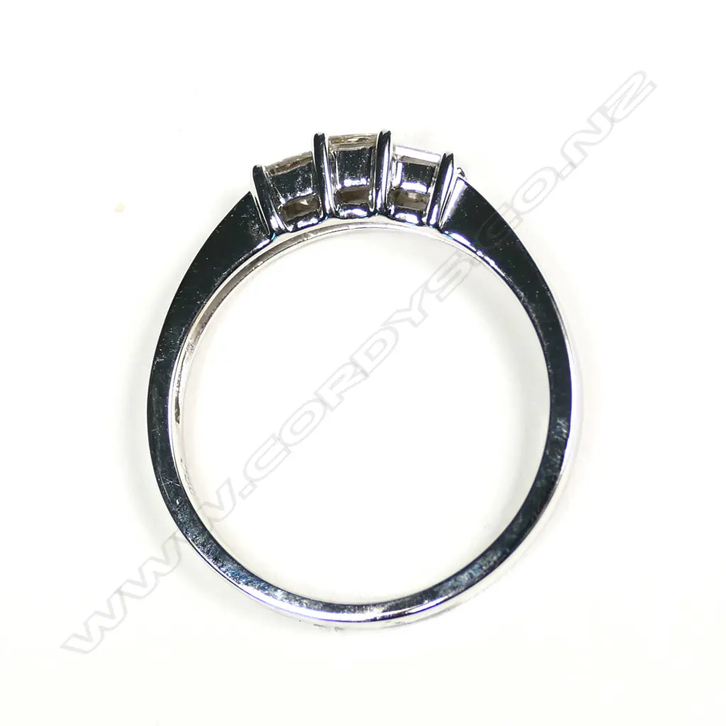 An 18ct white gold and three stone diamond ring Image 1++
