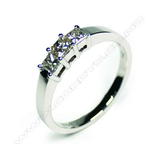 An 18ct white gold and three stone diamond ring