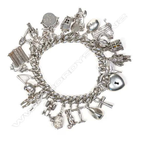 Heavy and laden silver curb link bracelet