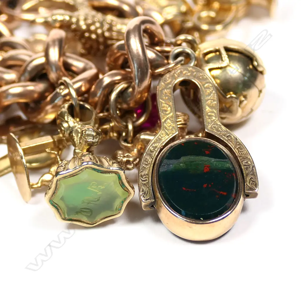A vintage 9ct rose gold charm bracelet Image 1++