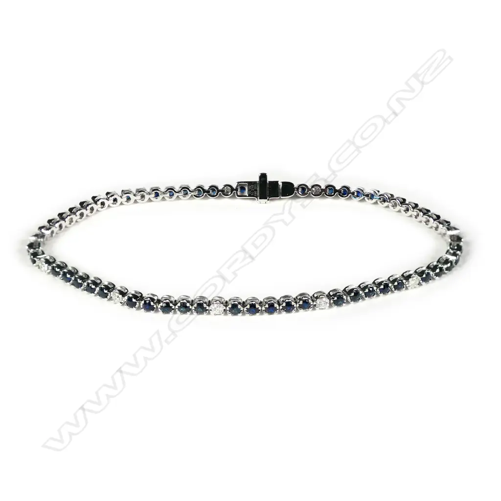 A 14ct white gold blue sapphire and diamond tennis bracelet Image 1++