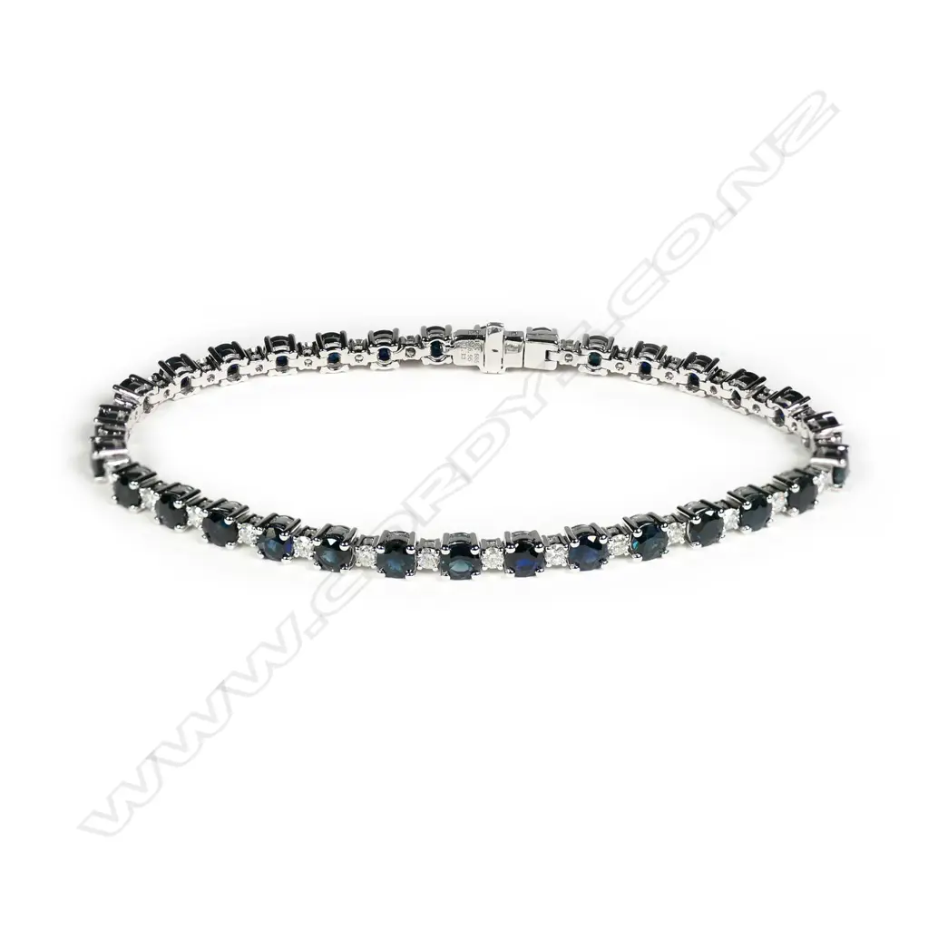 A 14ct white gold sapphire and diamond Image 1++