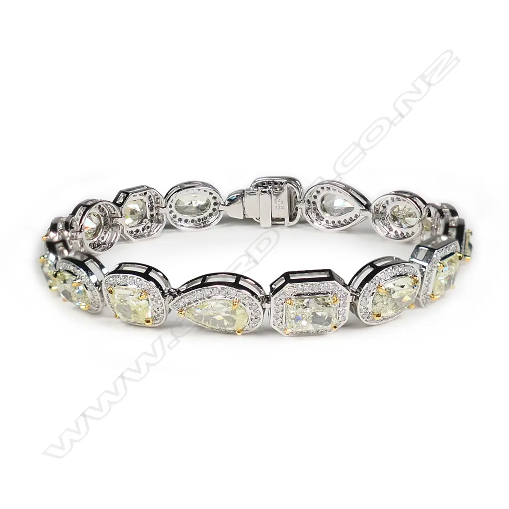 A 14ct white gold fancy yellow diamond halo bracelet Image 1++