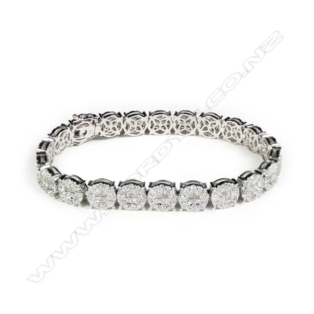 An 18ct gold and diamond multi cluster bracelet Image 1++