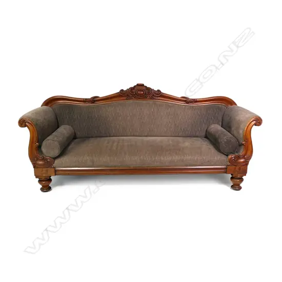 A Victorian mahogany scrolling arm sofa