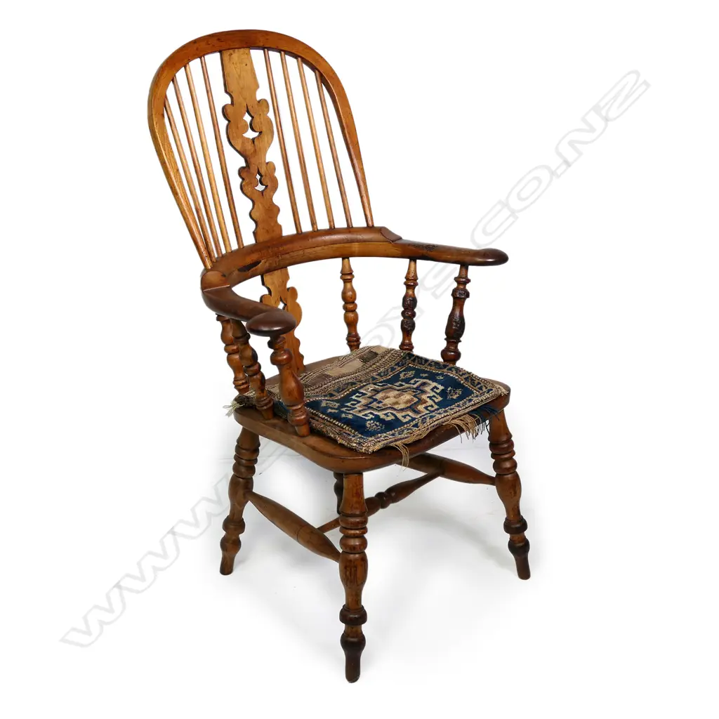 A Victorian ash and elm broad arm Windsor chair Image 1++