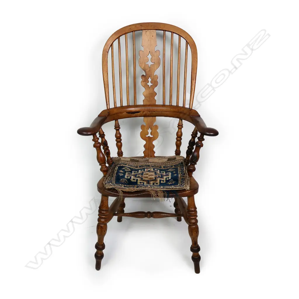 A Victorian ash and elm broad arm Windsor chair Image 1++