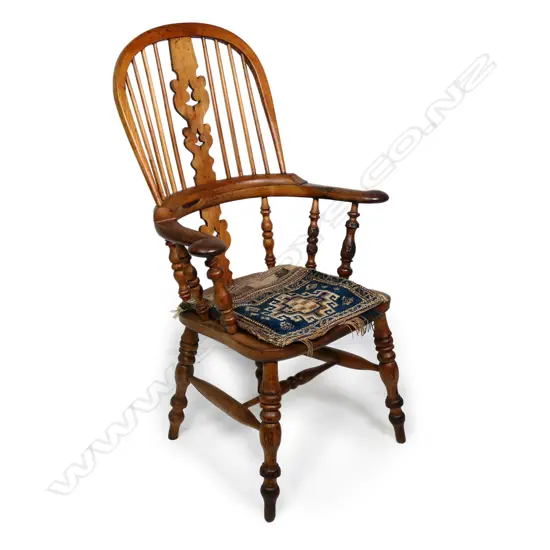 A Victorian ash and elm broad arm Windsor chair