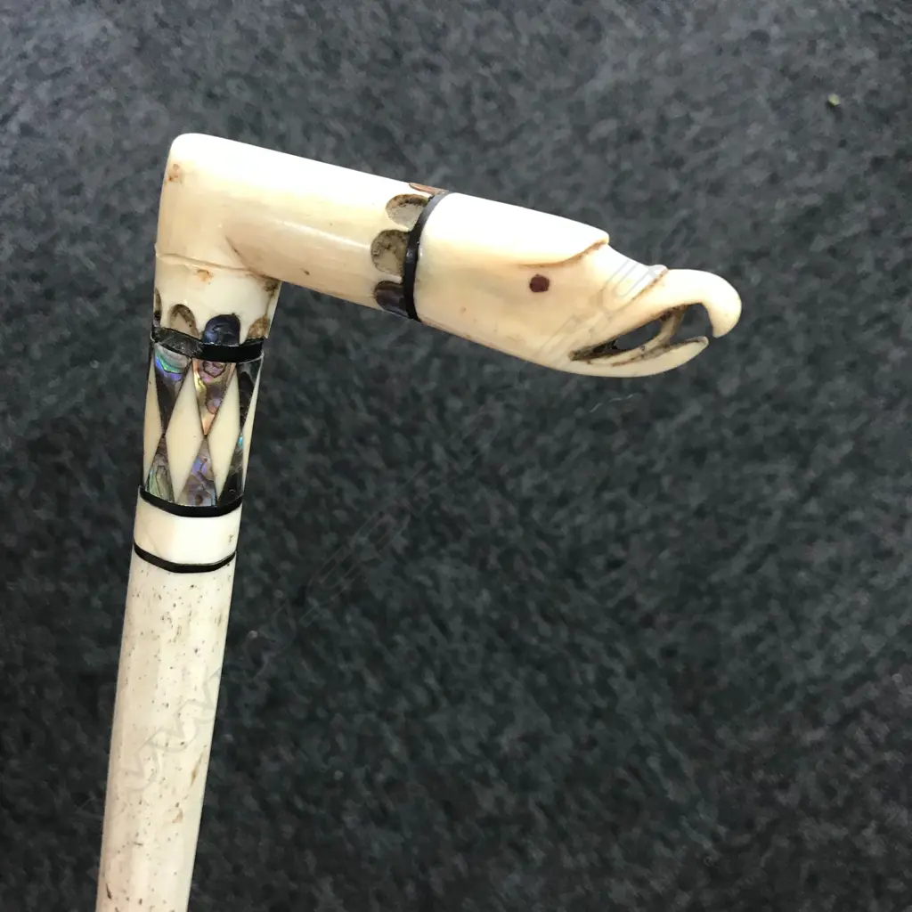A late 19thC carved whalebone walking stick Image 1++