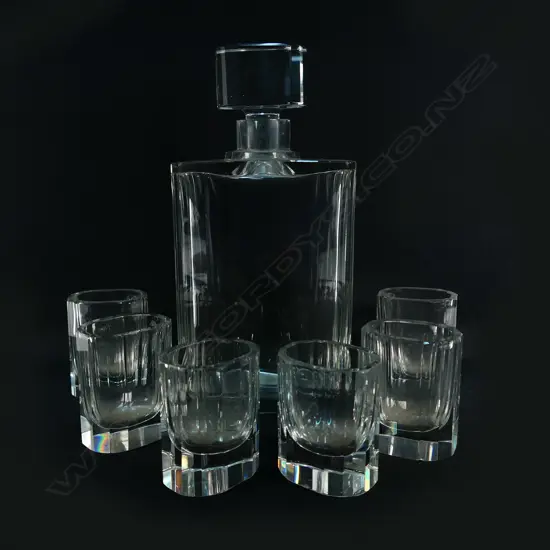 An Art Deco facetted clear glass decanter and six glass set