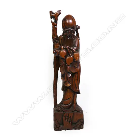 An old Oriental tall carved wooden figure of Shou Lao