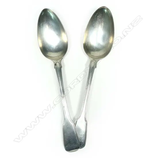 A near pair of Geo.III silver tablespoons