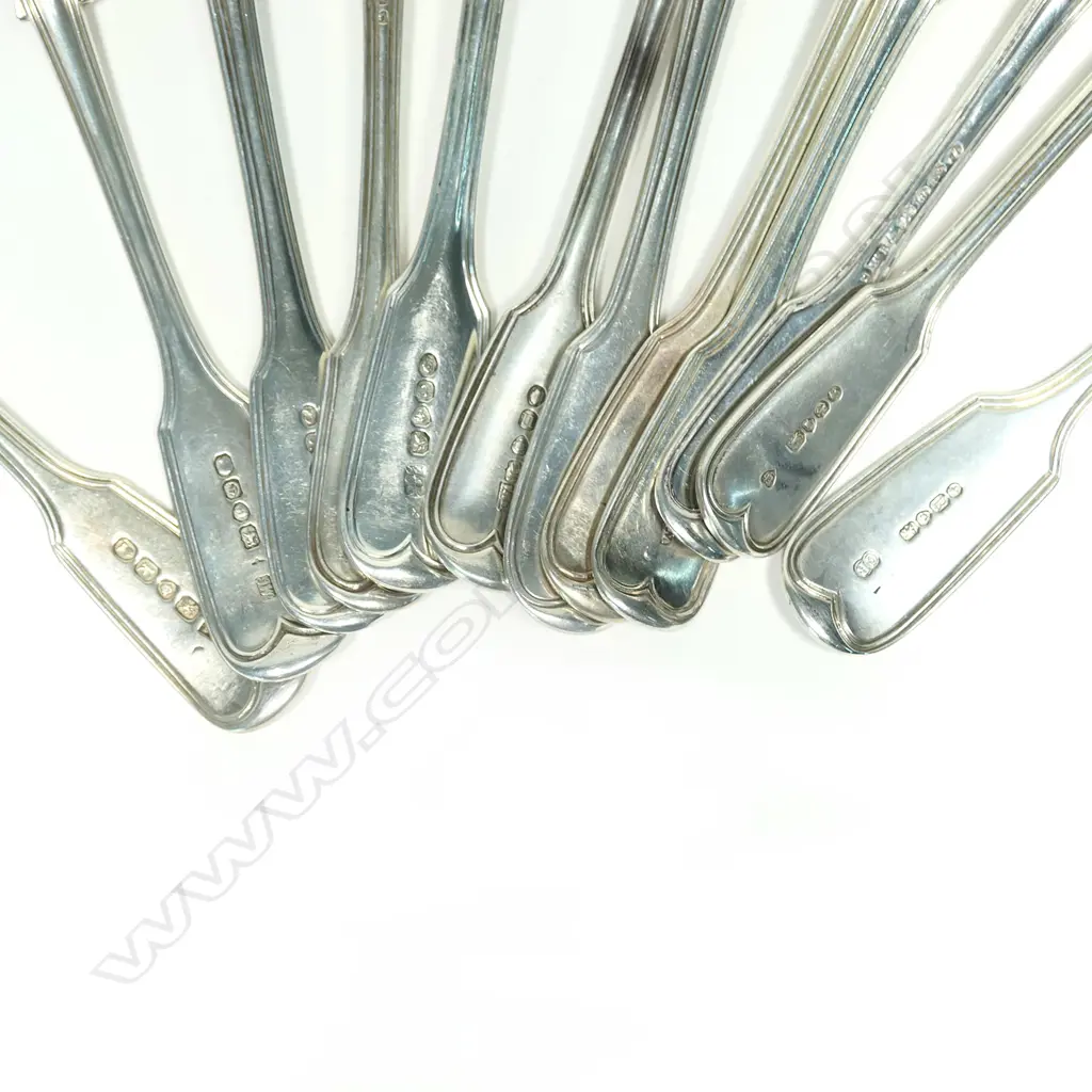 A mixed set of 12 c.1830/40 silver dessert spoons Image 1++