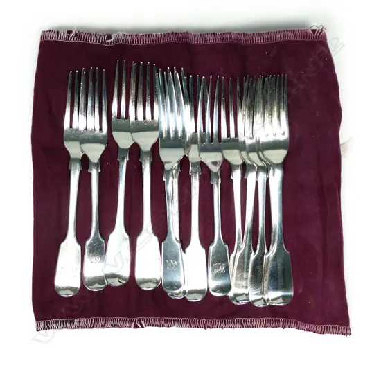 A mixed set of 13 silver dessert forks