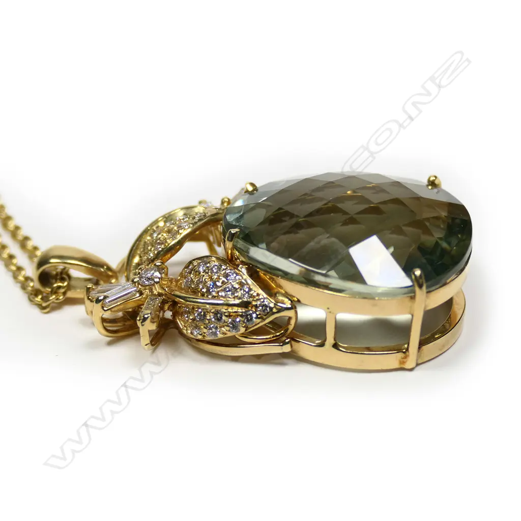 An 18ct yellow gold green quartz and diamond pendant on chain Image 1++