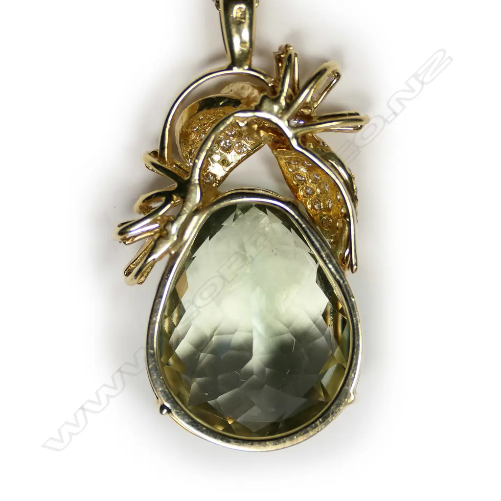 An 18ct yellow gold green quartz and diamond pendant on chain Image 1++