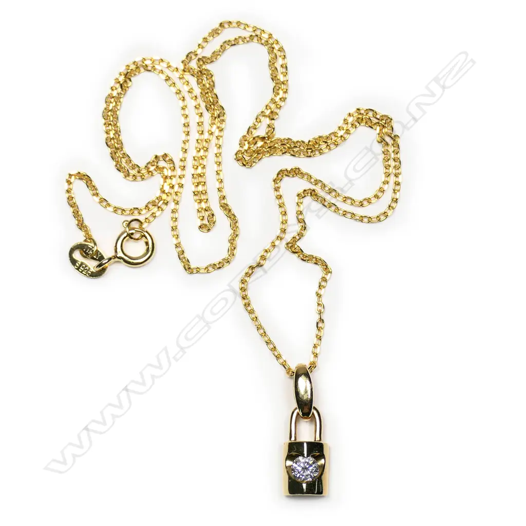 An 18ct yellow gold and diamond pendant on silver chain Image 1++