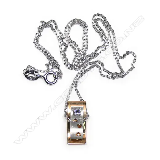 An 18ct yellow gold and  diamond pendant on silver chain