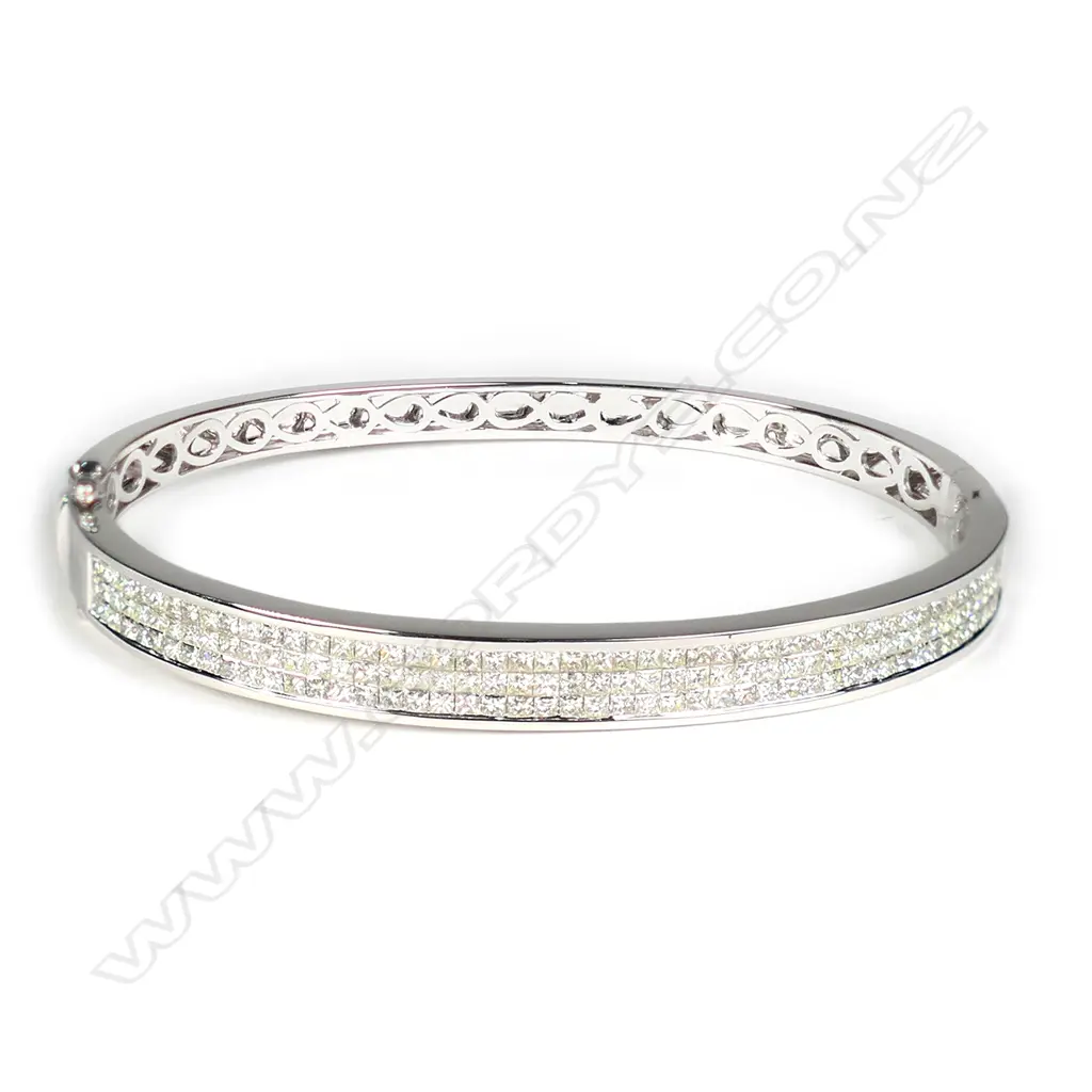 An 18ct white gold and multi diamond hinged bangle Image 1++