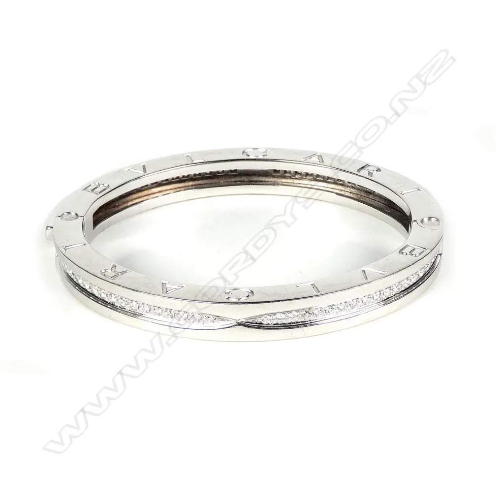 A Bvlgari 18ct white gold and diamond hinged bangle Image 1++