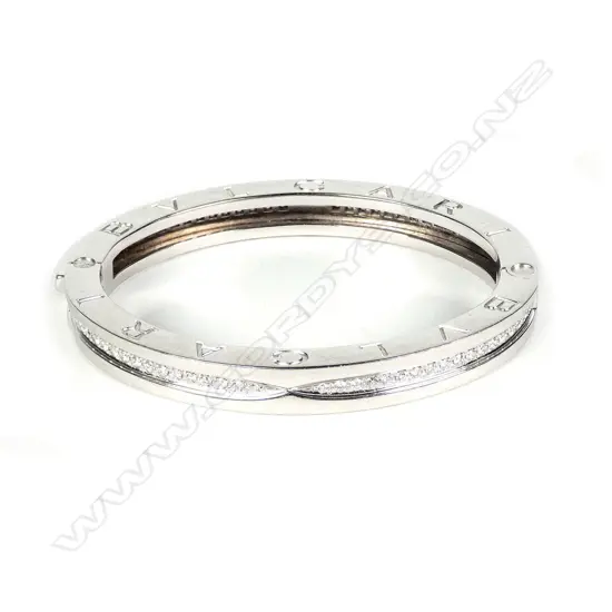 A Bvlgari 18ct white gold and diamond hinged bangle