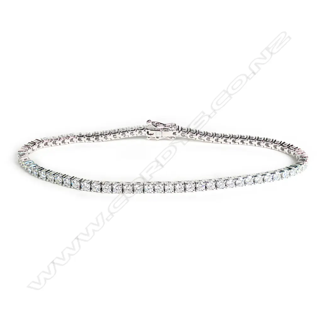 A modern 18ct white gold and diamond tennis bracelet Image 1++