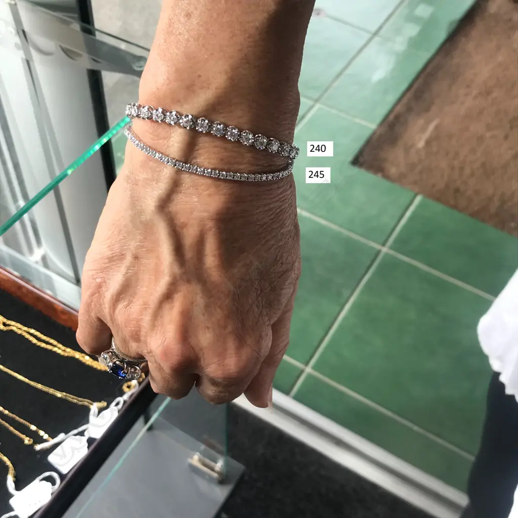 A modern 18ct white gold and diamond tennis bracelet Image 1++