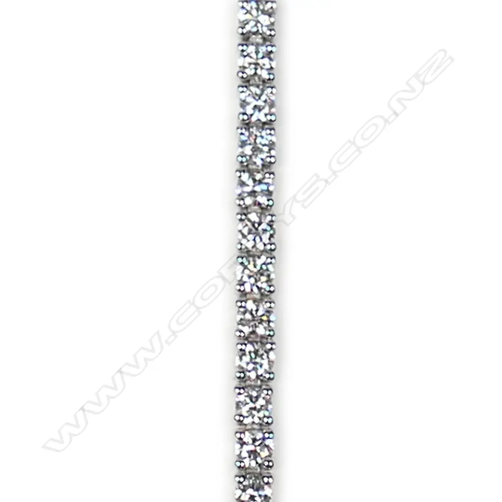 A modern 18ct white gold and diamond tennis bracelet Image 1++